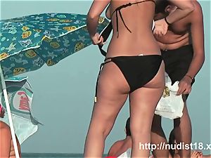 naked beach spycam movie of torrid playful nudists in water